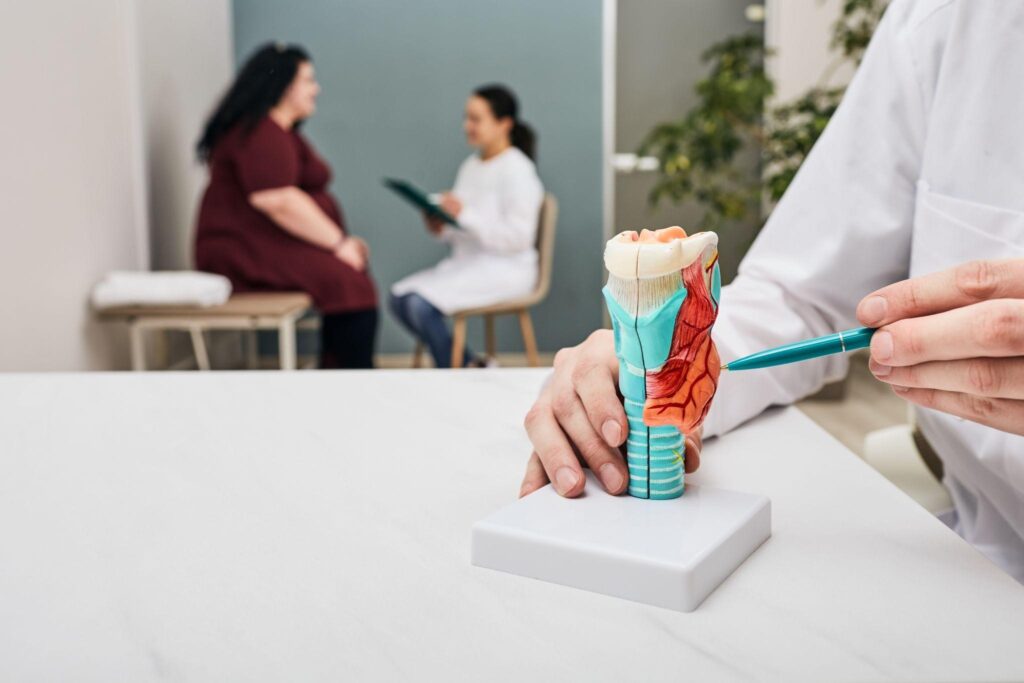  Dental implant consultation with a dentist explaining treatment options to a patient concerned about whether a tooth implant hurts.
