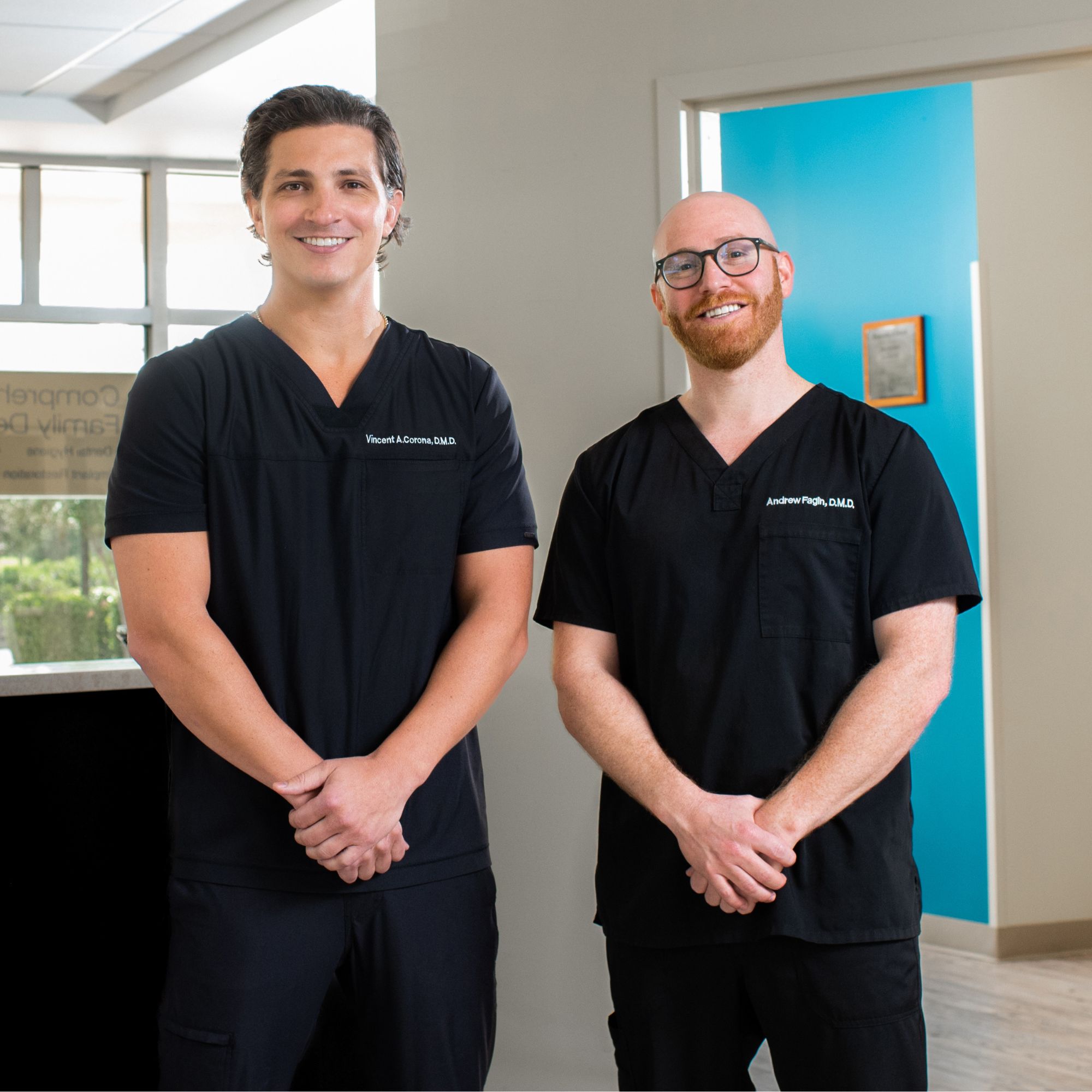 Friendly dentists at Corona Family Dental welcoming patients inside the modern Sarasota and Bradenton FL dental office
